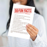 A person holding the Fun Facts card to demonstrate the scale and the heavy, professional feel of the paper.