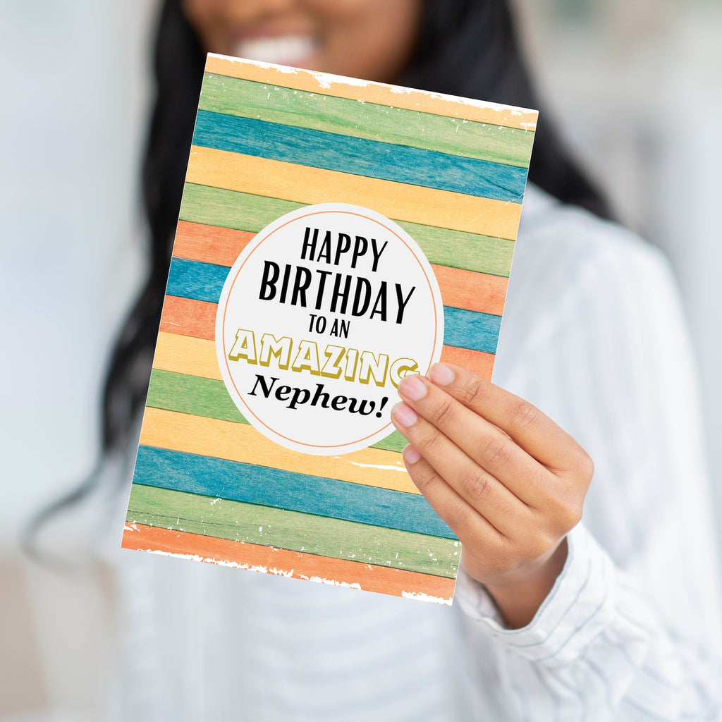 A person holding the colorful wood-design birthday card to demonstrate the substantial weight and professional feel of the paper.
