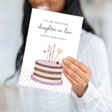 Close-up of a person holding the Amazing Daughter in Law card, showing the thick 320 GSM paper.