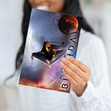 A person holding the sci-fi space birthday card to demonstrate the substantial weight and professional feel of the paper.